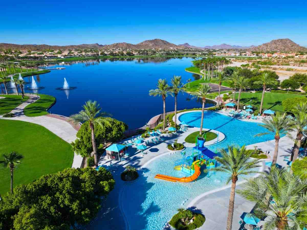 Bird's Eye view of Estrella showing mountains in background, lake, waterpark and golf course for article Estrella: The Heart of the Southwest Valley for newcomers moving to Phoenix.