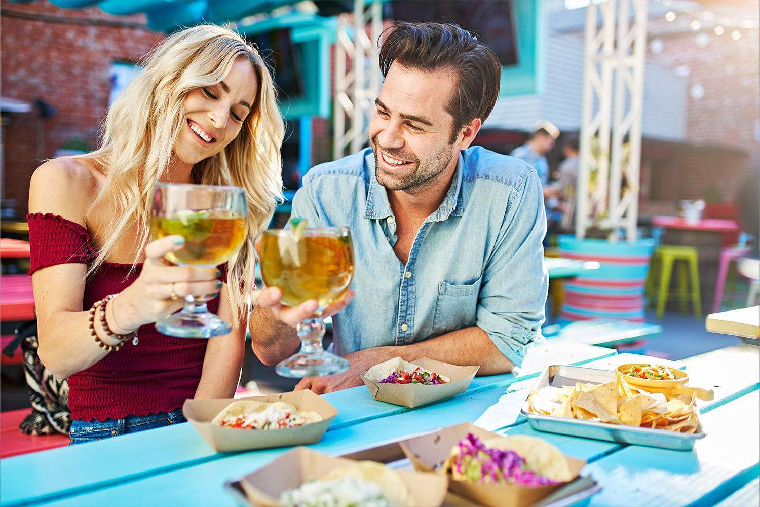 Couple enjoying mexican food on a patio