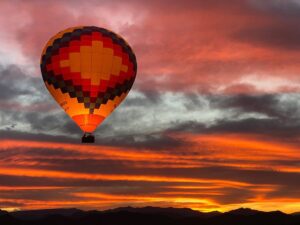 Hot air balloon in sunset sky over Phoenix area for article The Perfect Date Night in Phoenix for newcomers moving to Phoenix.