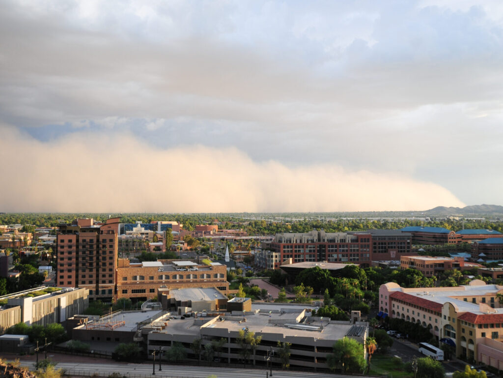 Dust storm approaching Phoenix.What does Arizona homeowners insurance not cover